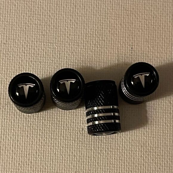 Tesla valve Stem caps in Black set of 4 NWT - Picture 1 of 4